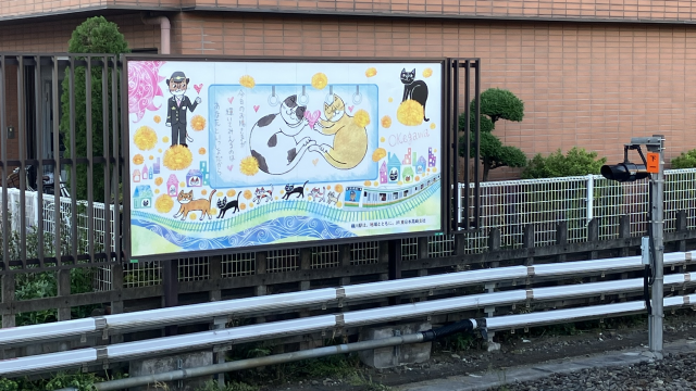 桶川駅/おかべてつろう猫イラスト看板